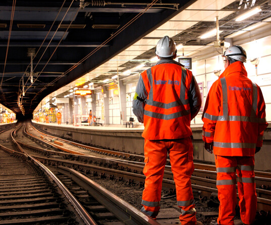 Rail workers on the tracks in a closed sub-surface station