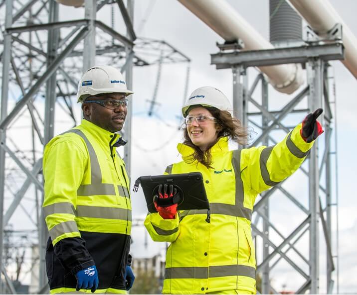Male and Female on construction site conversating